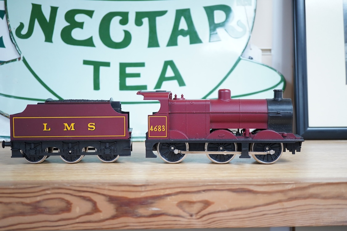 Eleven 0 gauge model railway items including; a bogie stake wagon, two mineral wagons, a North British coal wagon and two further open wagons, a partly constructed brake van, together with a Lima LMS 4F locomotive, two L